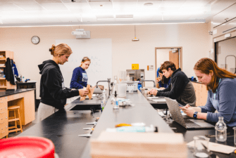 Biology major students work in a lab classroom setting