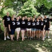 Group of people standing under a tree