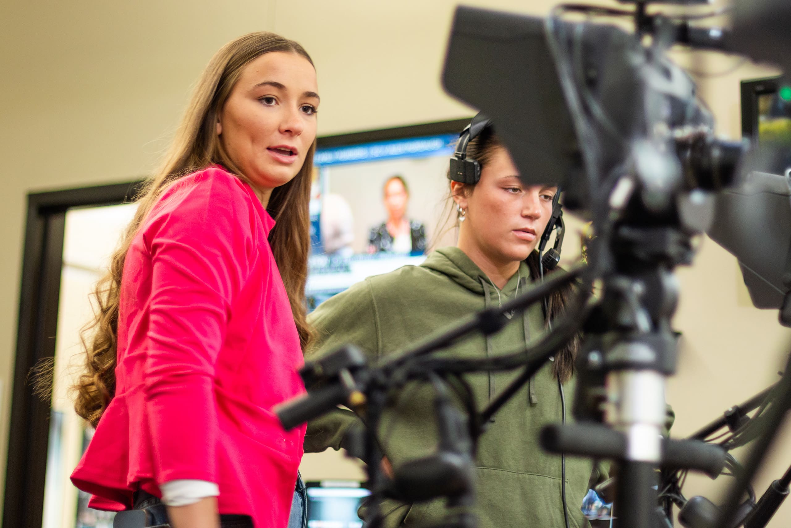 two students in asbury newsroom