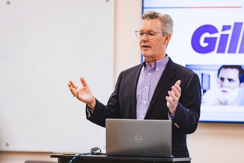 Dr. Allen teaching a marketing class in the Dayton School of Business.