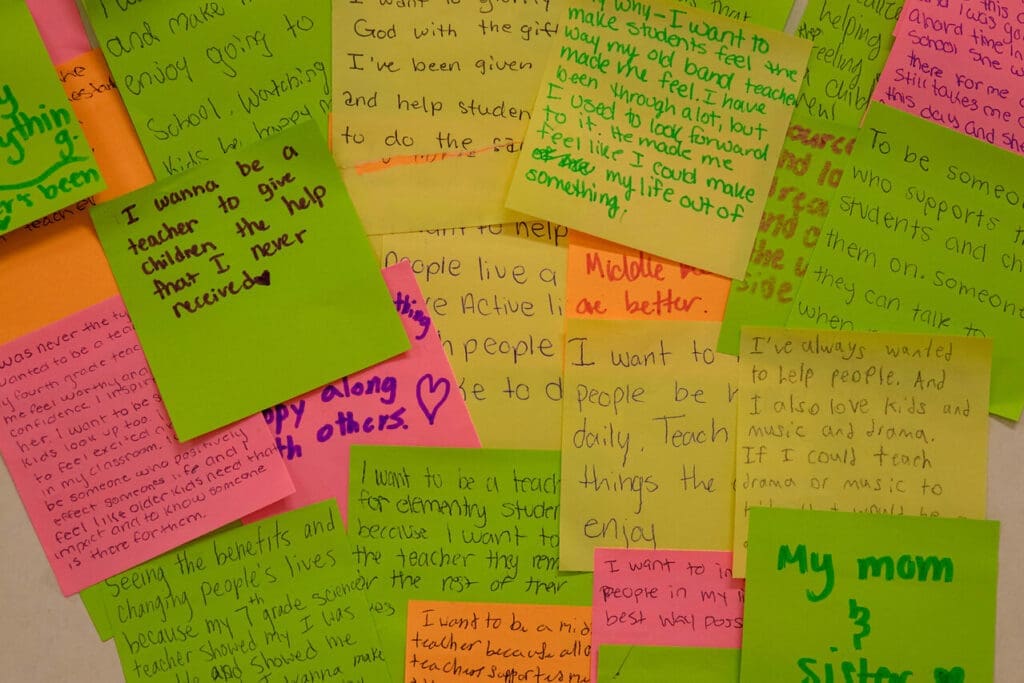 Post-it notes detailing why education students want to become teachers.