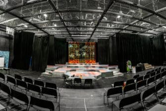 The inside seats and stage area of the Asbury Greathouse Theatre