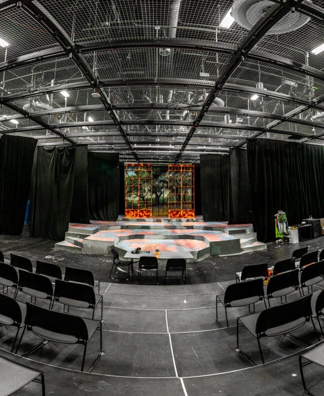 The inside seats and stage area of the Asbury Greathouse Theatre