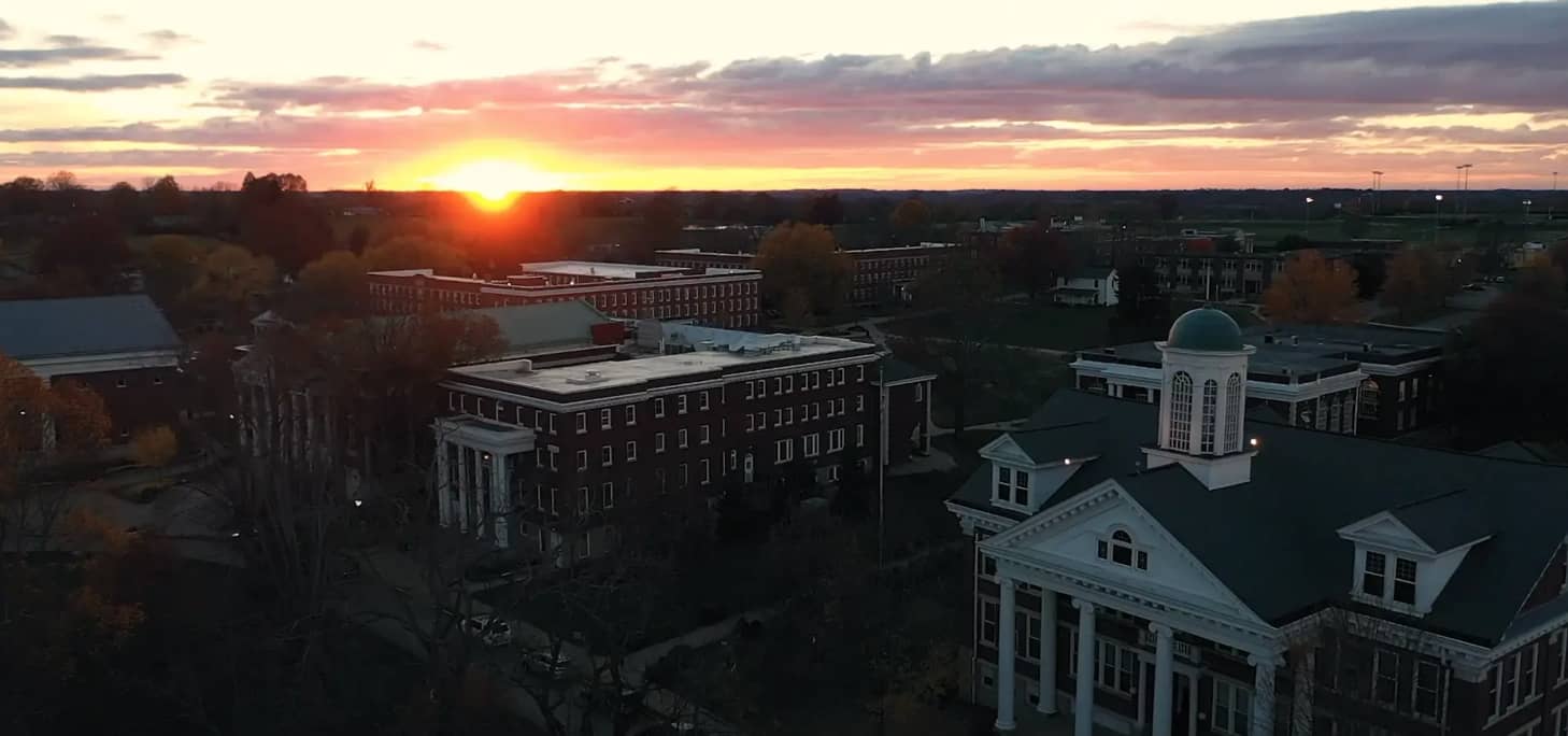 Early evening photo of the Asbury campus buildings with the sun setting