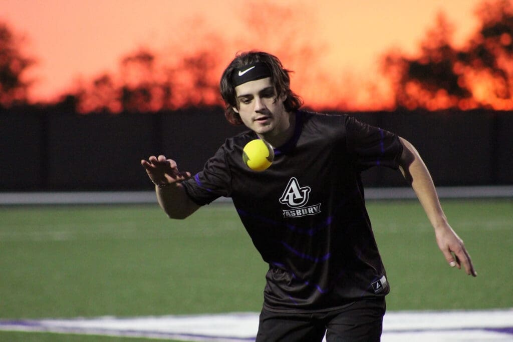 Asbury male student prepares to hit the ball back to his opponent