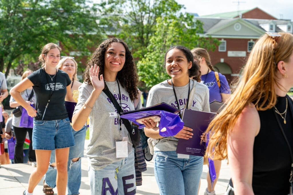 Asbury University Eagle Days with a group of students walking across the school campus. 