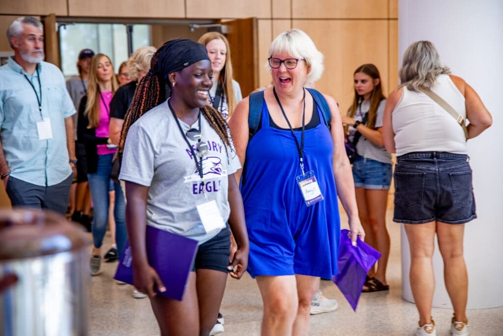 Two females walking at Asbury University's Eagle Days.