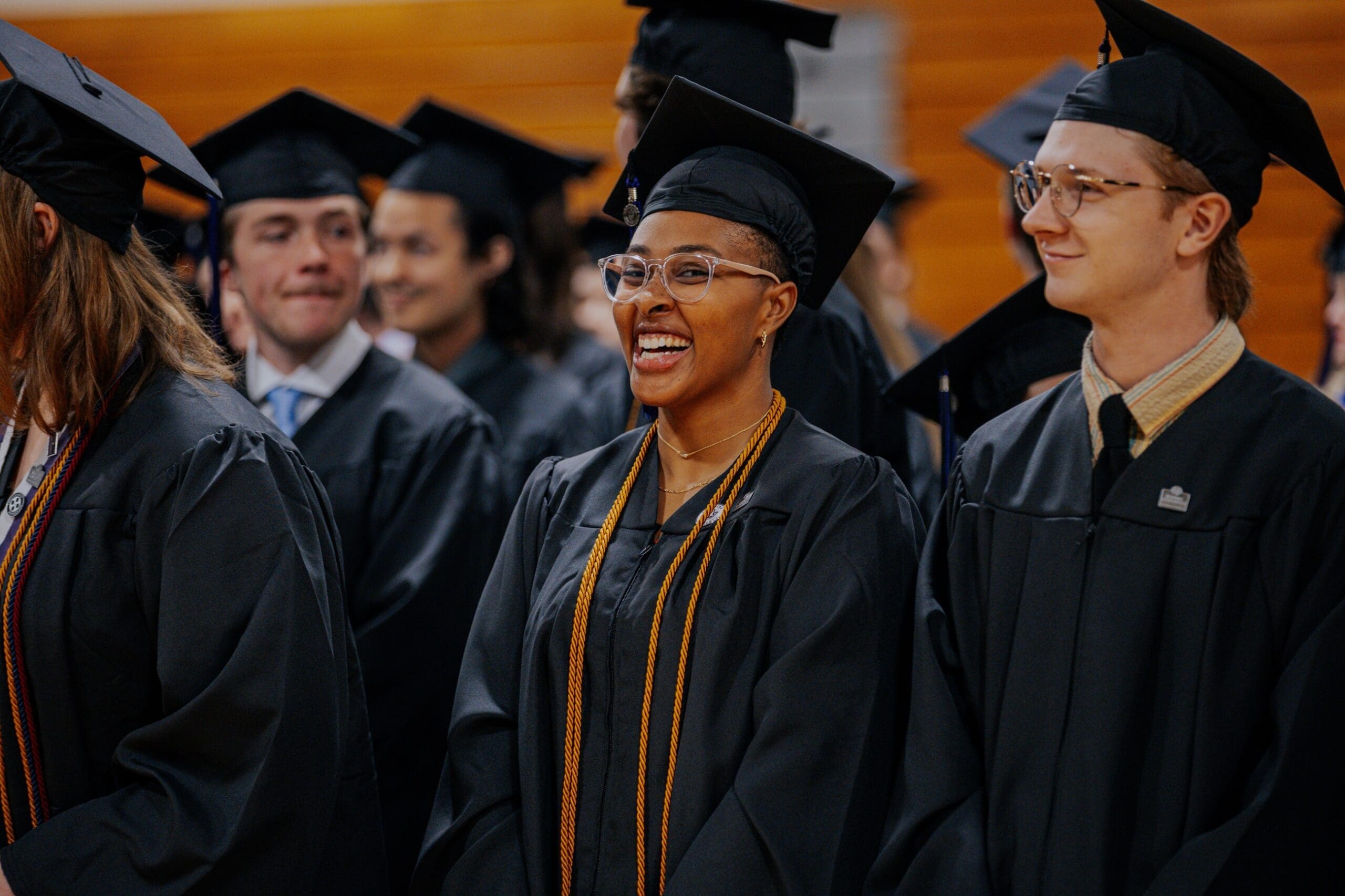Asbury University graduation female student in cap and gown to show financial aid opportunities.