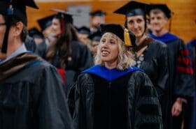 asbury university professors smile during academic convocation