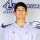 a male asbury tennis athlete smiles