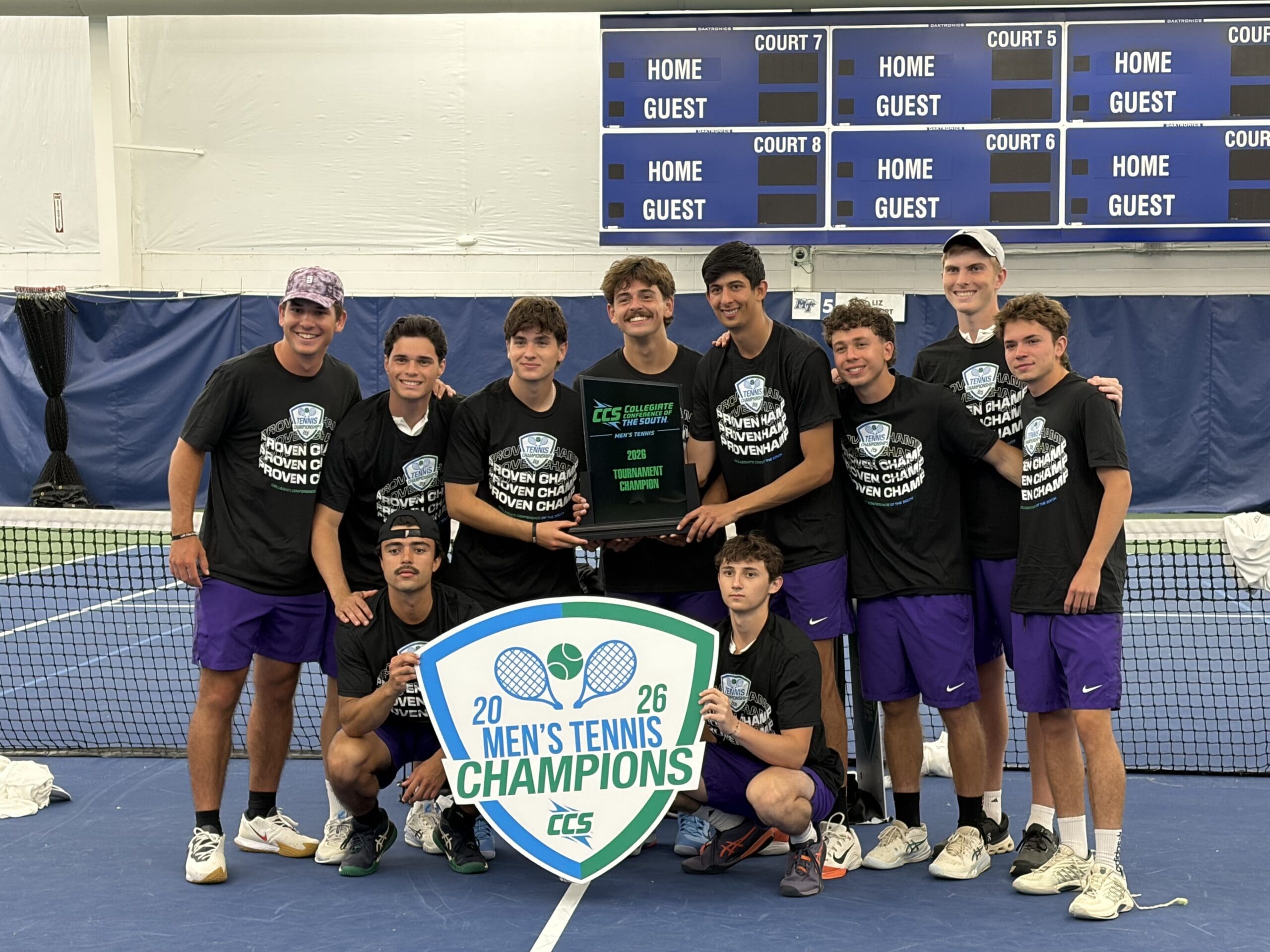 asbury men's tennis team stand smiling
