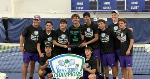 asbury men's tennis team stand smiling