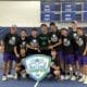 asbury men's tennis team stand smiling