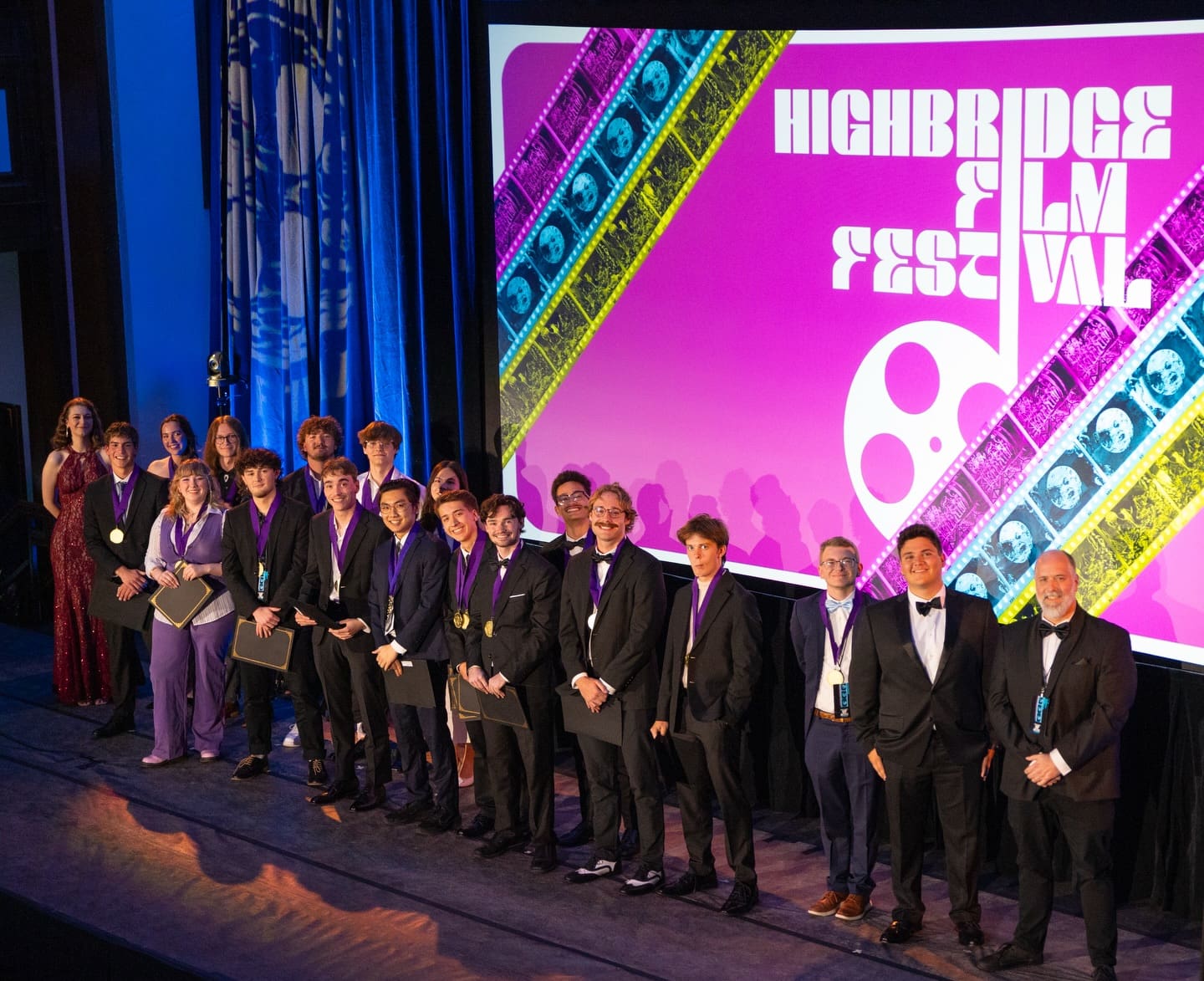 Asbury Highbridge winners stand on the Hughes Auditorium stage