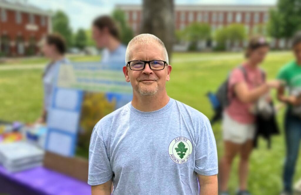Dr. Marvin Ruffner smiles on the Asbury University Reasoner Green lawn